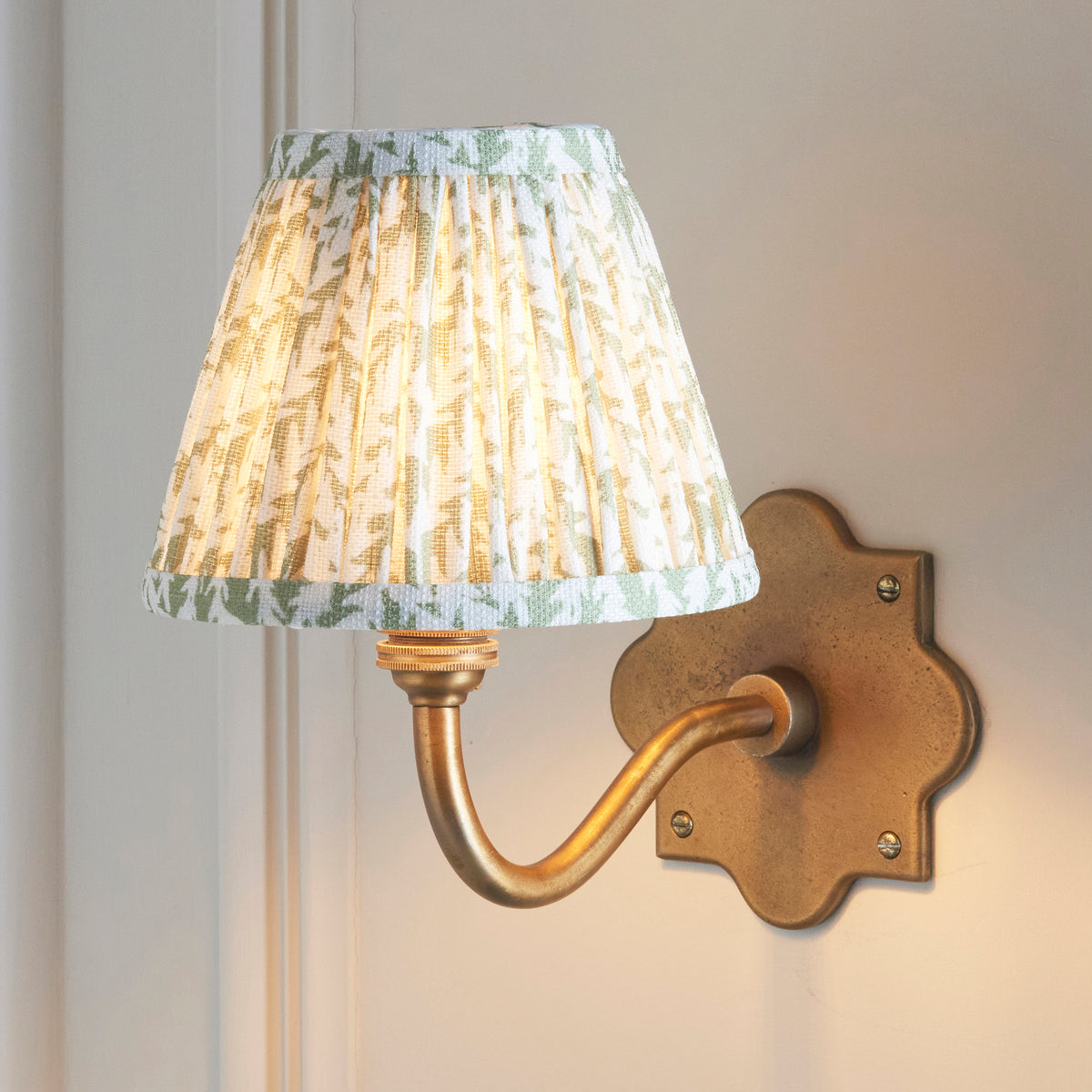Anvil Curve Antique Brass Wall Light with Green Leaf Shade