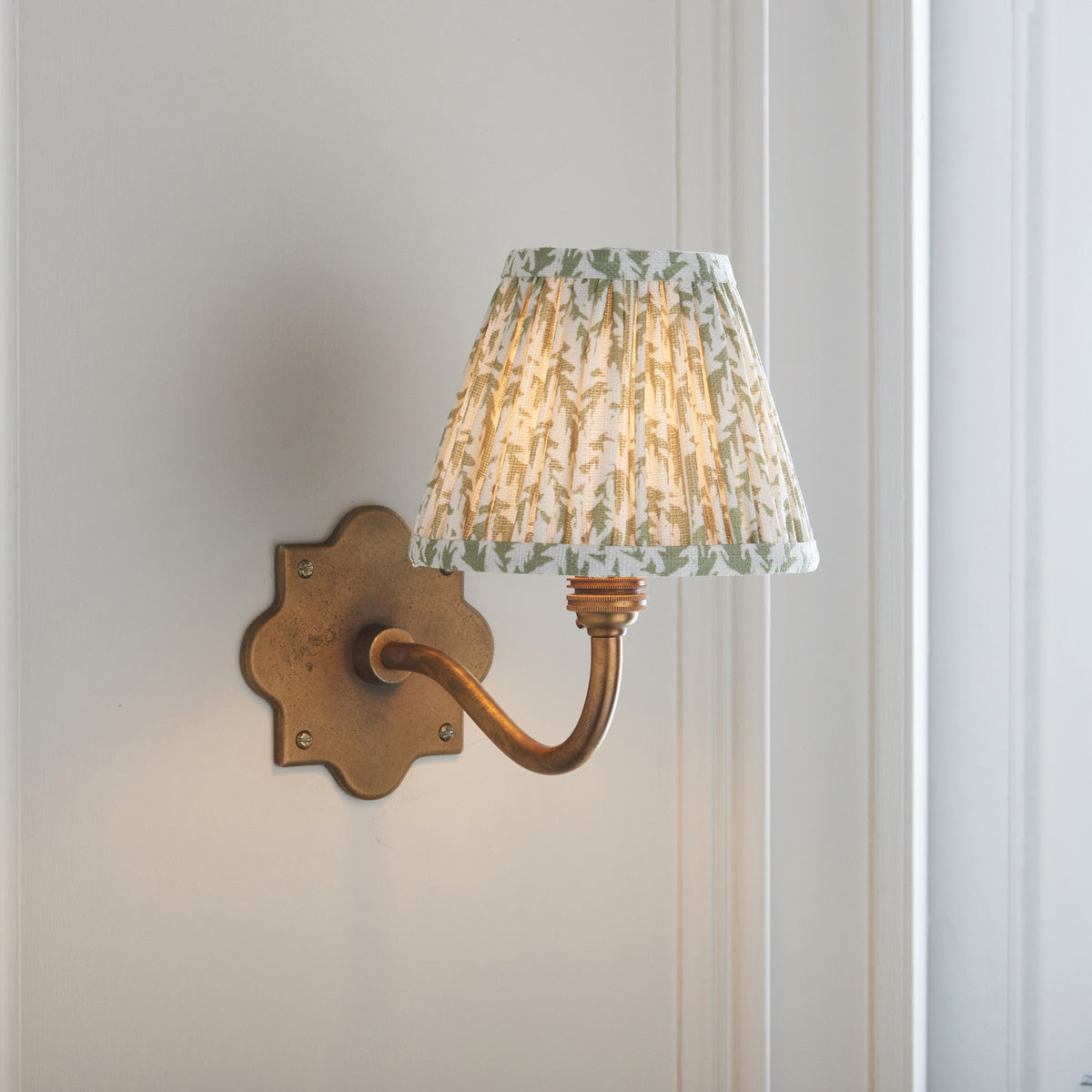 Anvil Curve Antique Brass Wall Light with Green Leaf Shade